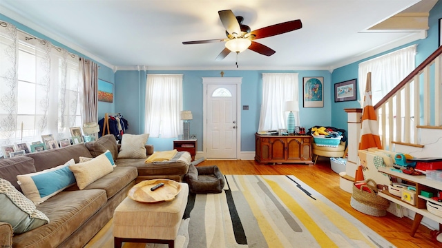 27 School St, Absecon, NJ 08201 - living room featuring healthy amount of natural light, stairs, a ceiling fan, and wood finished floors