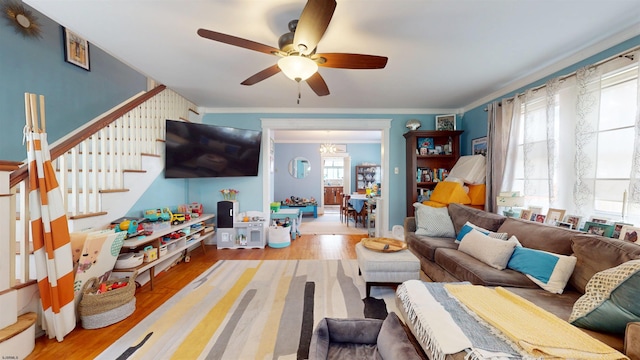 27 School St, Absecon, NJ 08201 - living area with ceiling fan, wood finished floors, ornamental molding, and stairs
