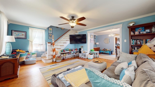 27 School St, Absecon, NJ 08201 - living room with crown molding, stairs, wood finished floors, ceiling fan, and baseboards