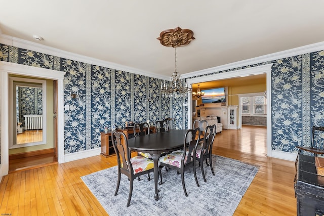 1 S Bartram Ave Unit 3, Atlantic City, NJ 08401 - dining space featuring a chandelier, baseboards, wallpapered walls, light wood-type flooring, and crown molding