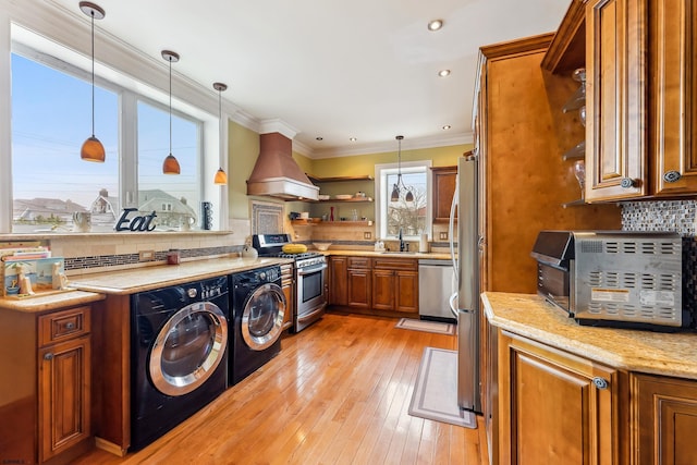 1 S Bartram Ave Unit 3, Atlantic City, NJ 08401 - laundry room featuring washing machine and dryer, light wood-style flooring, crown molding, and recessed lighting