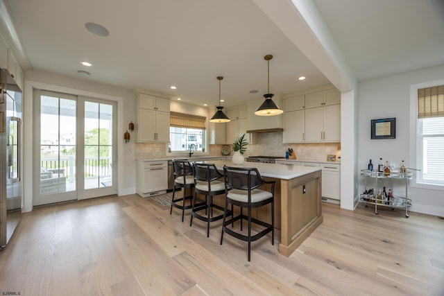 3708 Westminster Ln, Ocean City, NJ 08226 - kitchen featuring a sink, light countertops, light wood finished floors, backsplash, and recessed lighting