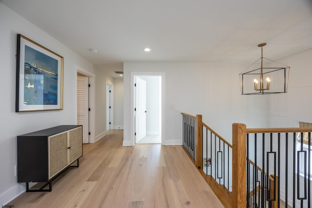 3708 Westminster Ln, Ocean City, NJ 08226 - hall with an upstairs landing, a chandelier, light wood-type flooring, baseboards, and recessed lighting