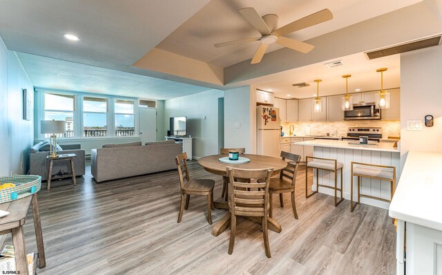 500 Bay Ave Unit 607S, Ocean City, NJ 08226 - dining space featuring light wood-type flooring, ceiling fan, and recessed lighting