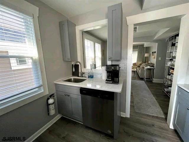 804 Delancey Pl Unit 2, Ocean City, NJ 08203 - kitchen featuring dishwasher, gray cabinetry, a sink, light countertops, and dark wood-style flooring