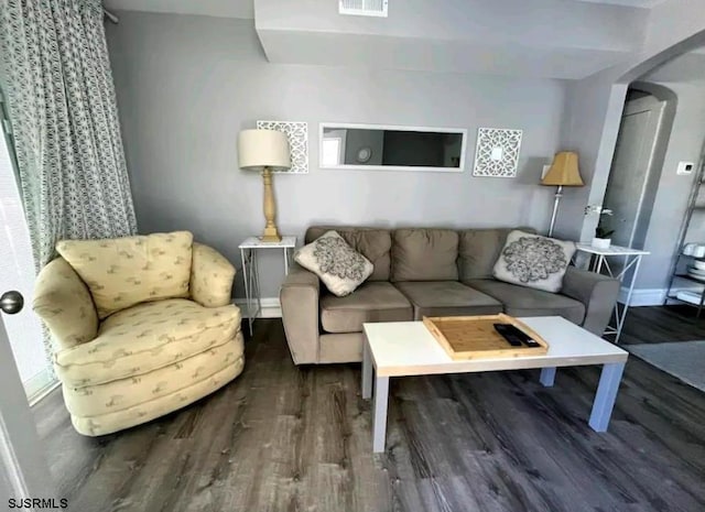 804 Delancey Pl Unit 2, Ocean City, NJ 08203 - living room featuring wood finished floors, arched walkways, and baseboards