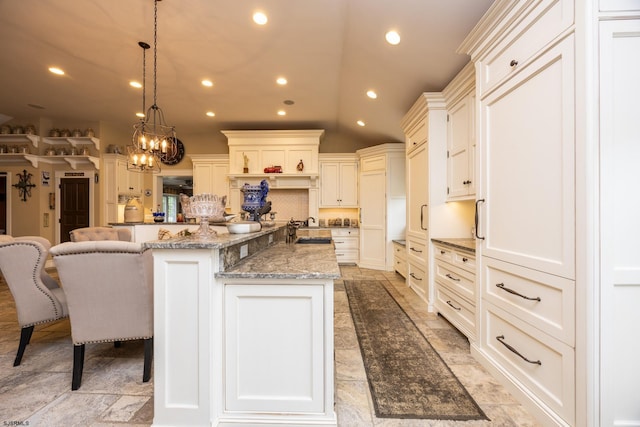 3065 N Rte 9, Ocean View, NJ 08230 - kitchen with a sink, a large island, lofted ceiling, a chandelier, and a kitchen bar