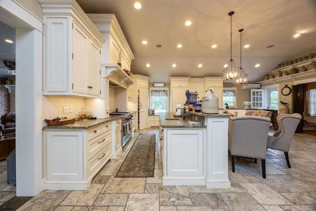 3065 N Rte 9, Ocean View, NJ 08230 - kitchen featuring stainless steel stove, stone tile floors, recessed lighting, vaulted ceiling, and dark stone counters