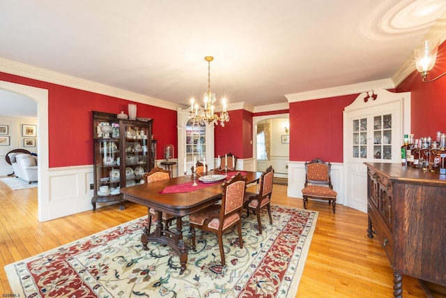 3065 N Rte 9, Ocean View, NJ 08230 - dining space featuring arched walkways, light wood finished floors, a chandelier, wainscoting, and ornamental molding