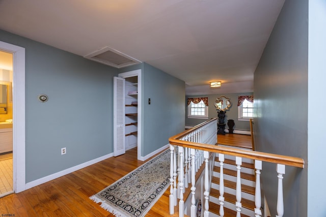 3065 N Rte 9, Ocean View, NJ 08230 - corridor with an upstairs landing, wood finished floors, attic access, baseboards, and a baseboard radiator