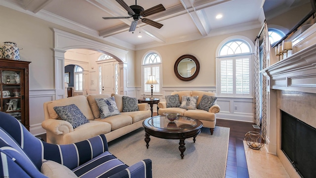 8904 Ventnor Ave, Margate, NJ 08402 - living area with coffered ceiling, arched walkways, a decorative wall, a high end fireplace, and beam ceiling