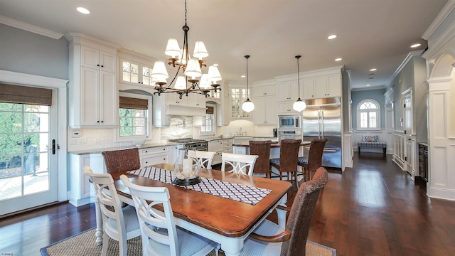 8904 Ventnor Ave, Margate, NJ 08402 - dining room featuring crown molding, dark wood finished floors, a chandelier, and recessed lighting