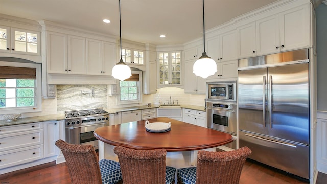 8904 Ventnor Ave, Margate, NJ 08402 - kitchen with built in appliances, a sink, glass insert cabinets, dark wood-style floors, and white cabinets