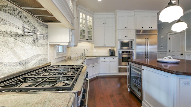 8904 Ventnor Ave, Margate, NJ 08402 - kitchen featuring stainless steel appliances, dark wood-type flooring, beverage cooler, a sink, and white cabinets