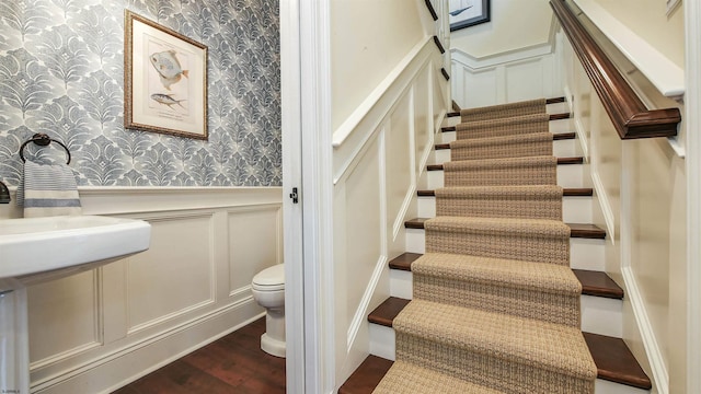 8904 Ventnor Ave, Margate, NJ 08402 - staircase with wallpapered walls, a decorative wall, wood finished floors, and wainscoting