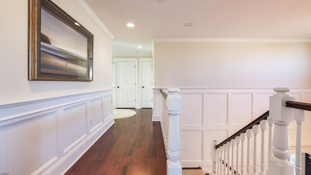 8904 Ventnor Ave, Margate, NJ 08402 - corridor with a decorative wall, crown molding, dark wood-type flooring, a wainscoted wall, and an upstairs landing