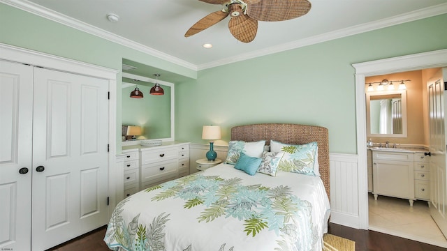 8904 Ventnor Ave, Margate, NJ 08402 - bedroom featuring crown molding, a wainscoted wall, ensuite bathroom, a closet, and a ceiling fan