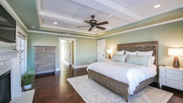 8904 Ventnor Ave, Margate, NJ 08402 - bedroom with coffered ceiling, crown molding, a fireplace with raised hearth, dark wood-style flooring, and baseboards