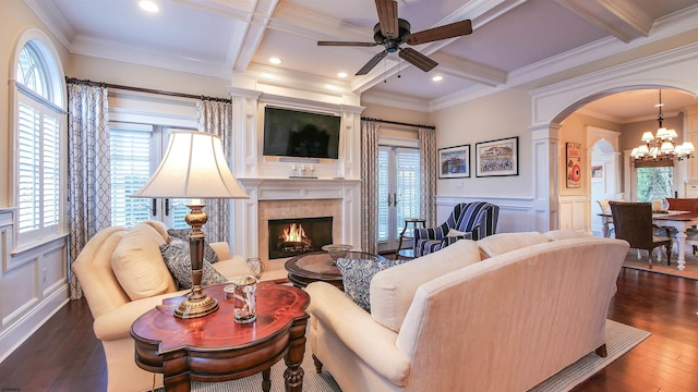 8904 Ventnor Ave, Margate, NJ 08402 - living area with coffered ceiling, a high end fireplace, arched walkways, ceiling fan, and a decorative wall
