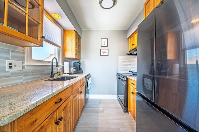 3 Schooner Cv Unit B, Brigantine, NJ 08203 - kitchen featuring black appliances, brown cabinets, a sink, and under cabinet range hood