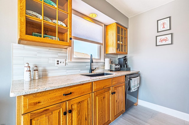 3 Schooner Cv Unit B, Brigantine, NJ 08203 - kitchen with a sink, dishwasher, baseboards, backsplash, and brown cabinetry