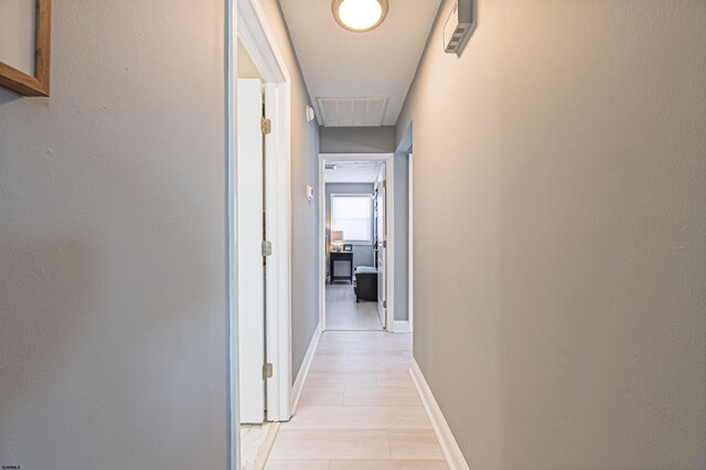 3 Schooner Cv Unit B, Brigantine, NJ 08203 - corridor featuring attic access, baseboards, and light tile patterned flooring