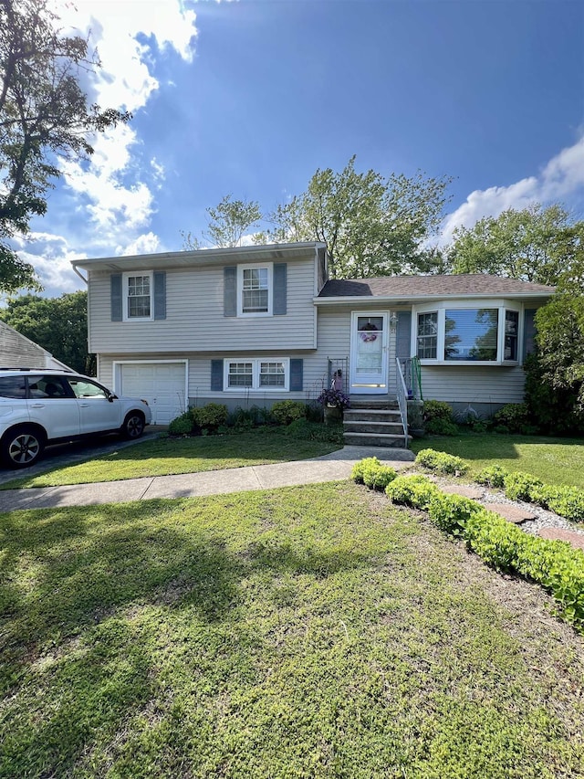 61 Bucknell Rd, Somers Point, NJ 08244 - tri-level home featuring a garage and a front lawn