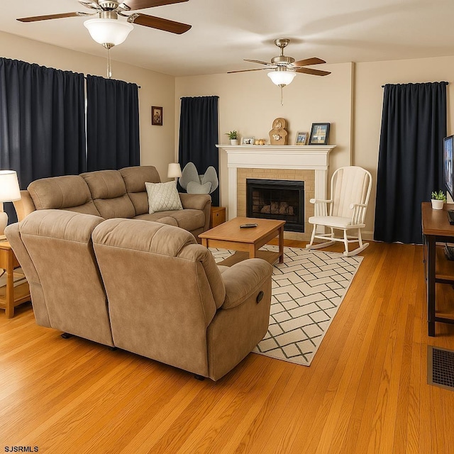 17 Lakeside Dr, Bridgeton, NJ 08302 - living area with ceiling fan, light wood-type flooring, and a fireplace