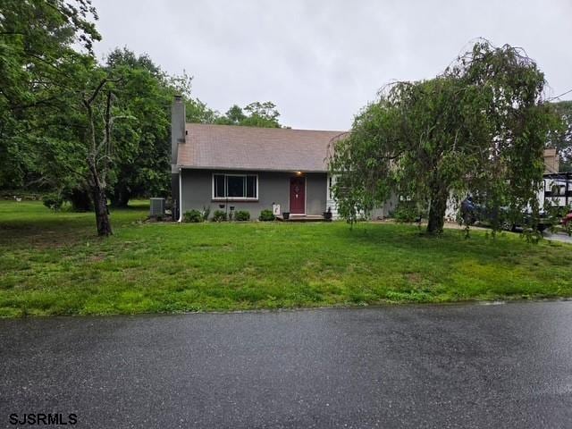 17 Lakeside Dr, Bridgeton, NJ 08302 - view of front of house with a front yard, cooling unit, and a chimney