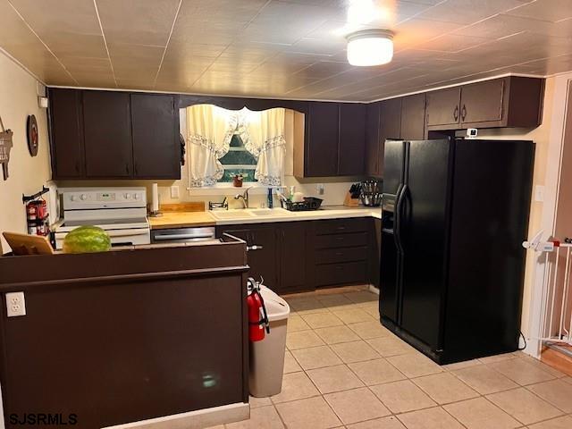 17 Lakeside Dr, Bridgeton, NJ 08302 - kitchen with black refrigerator with ice dispenser, white electric range oven, a sink, light tile patterned flooring, and dishwasher
