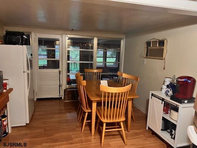 17 Lakeside Dr, Bridgeton, NJ 08302 - dining room with wood finished floors and a wall mounted air conditioner