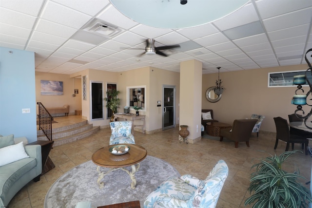6101 Monmouth Ave Unit 201, Ventnor, NJ 08406 - living area featuring a paneled ceiling, stairs, and light tile patterned flooring