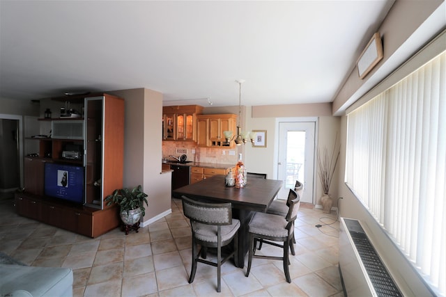 6101 Monmouth Ave Unit 201, Ventnor, NJ 08406 - dining room featuring light tile patterned floors, radiator, and baseboards