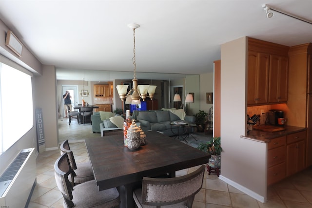 6101 Monmouth Ave Unit 201, Ventnor, NJ 08406 - dining space featuring a chandelier and light tile patterned flooring