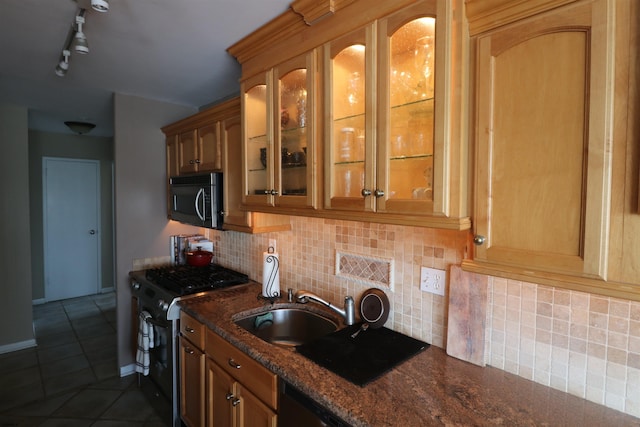 6101 Monmouth Ave Unit 201, Ventnor, NJ 08406 - kitchen featuring stainless steel microwave, black gas range oven, a sink, glass insert cabinets, and dark tile patterned flooring