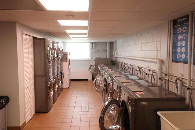 6101 Monmouth Ave Unit 201, Ventnor, NJ 08406 - shared laundry featuring washing machine and clothes dryer and light tile patterned flooring