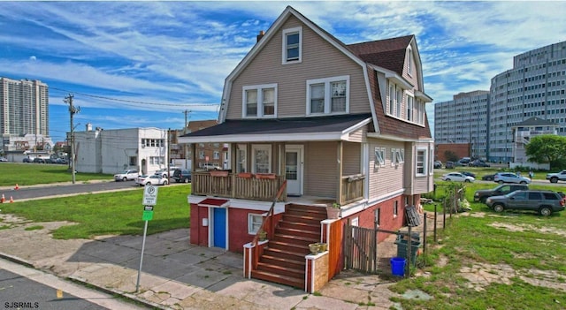 205 S Vermont Ave, Atlantic City, NJ 08401 - dutch colonial with a gambrel roof, covered porch, stairs, and a garage