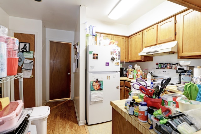 1426 Mediterranean Ave Unit C, Atlantic City, NJ 08401 - kitchen with white appliances, under cabinet range hood, light countertops, and light wood-style floors
