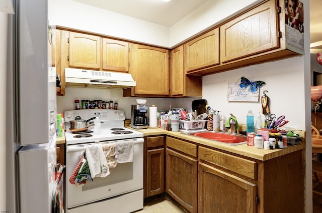 1426 Mediterranean Ave Unit C, Atlantic City, NJ 08401 - kitchen with white appliances, under cabinet range hood, a sink, and light countertops