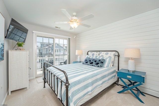 1525 Asbury Ave Unit B, Ocean City, NJ 08226 - carpeted bedroom featuring baseboards, ceiling fan, access to exterior, and wood walls