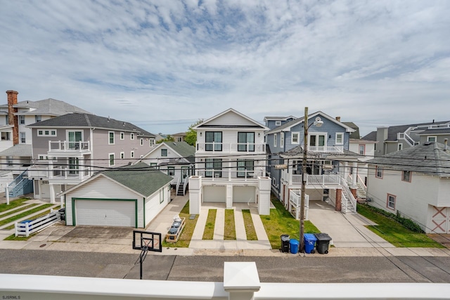 1525 Asbury Ave Unit B, Ocean City, NJ 08226 - view of front of home with a residential view, a garage, and concrete driveway