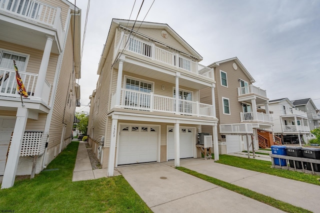 1525 Asbury Ave Unit B, Ocean City, NJ 08226 - view of front facade featuring a garage, driveway, and a balcony