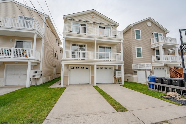 1525 Asbury Ave Unit B, Ocean City, NJ 08226 - view of front of home featuring a garage, concrete driveway, and a front lawn