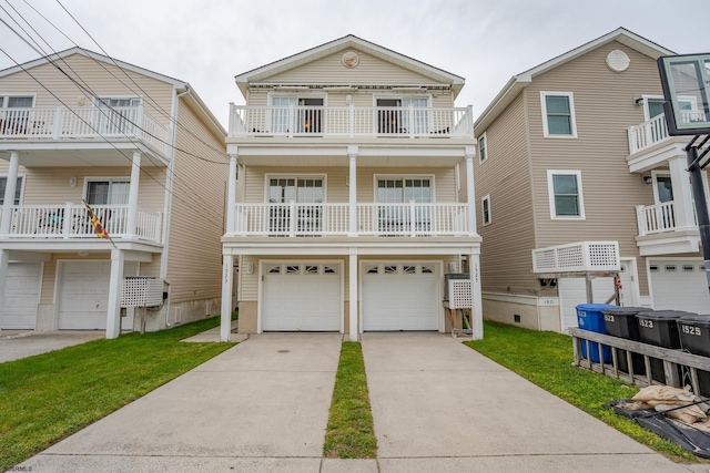 1525 Asbury Ave Unit B, Ocean City, NJ 08226 - raised beach house featuring an attached garage, a balcony, driveway, and a front lawn