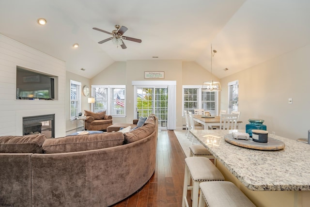 1525 Asbury Ave Unit B, Ocean City, NJ 08226 - living area featuring vaulted ceiling, ceiling fan, a large fireplace, dark wood-type flooring, and plenty of natural light