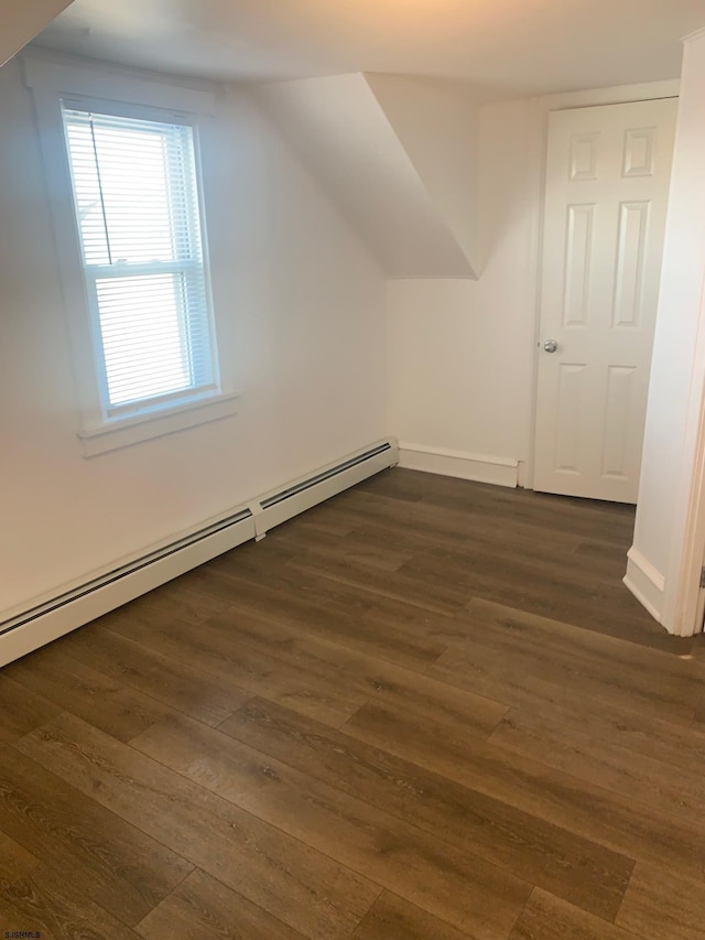 212 N Suffolk Ave, Ventnor Heights, NJ 08406 - bonus room with baseboard heating, dark wood-type flooring, baseboards, and vaulted ceiling