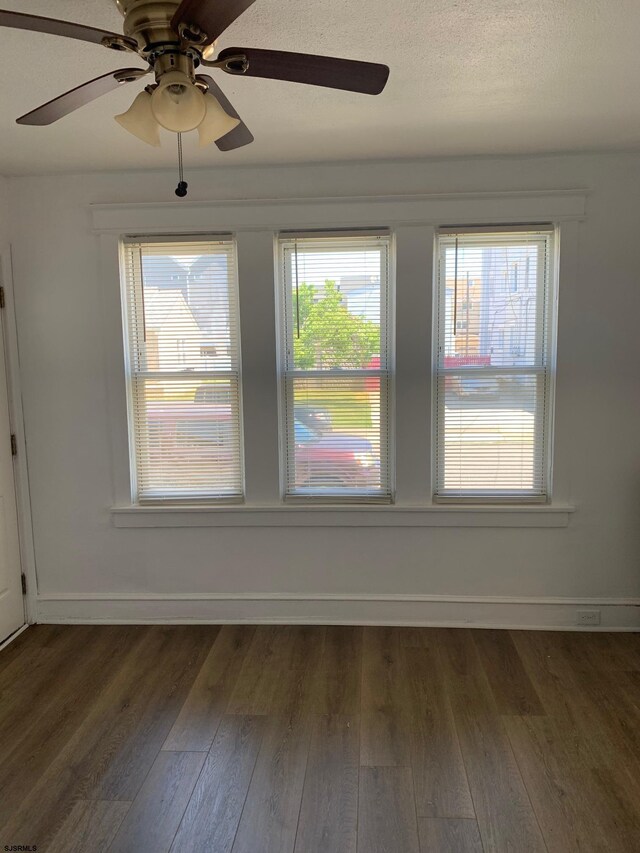 212 N Suffolk Ave, Ventnor Heights, NJ 08406 - spare room featuring a ceiling fan, dark wood-type flooring, and plenty of natural light