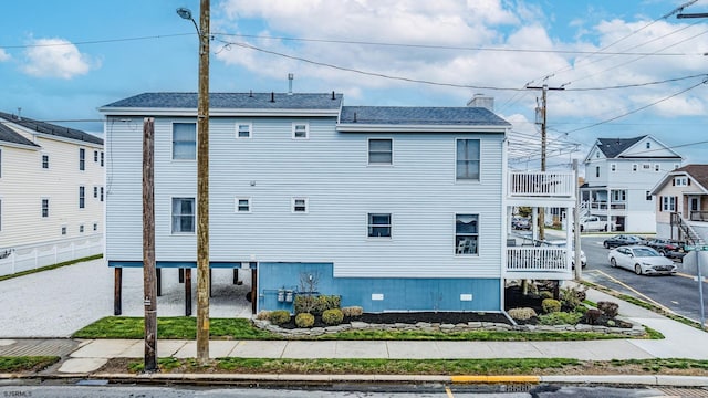 18 E 14th St Unit 2, Ocean City, NJ 08226 - view of home's exterior featuring uncovered parking and a chimney