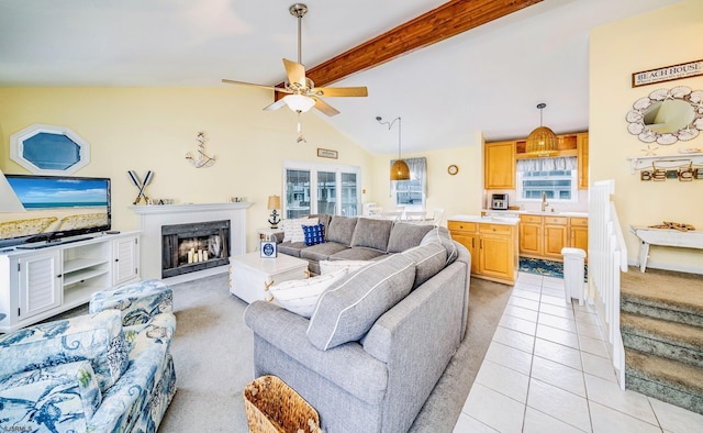 18 E 14th St Unit 2, Ocean City, NJ 08226 - living area featuring a ceiling fan, light tile patterned floors, light colored carpet, and a fireplace
