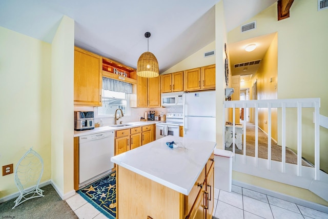 18 E 14th St Unit 2, Ocean City, NJ 08226 - kitchen with white appliances, vaulted ceiling, a sink, light countertops, and pendant lighting
